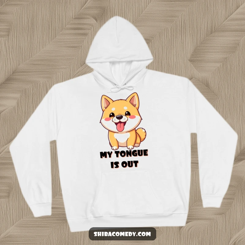 Funny Shiba Inu Hoodie: A playful Shiba Inu dog sticks its tongue out, offering cozy comfort and a funny design.