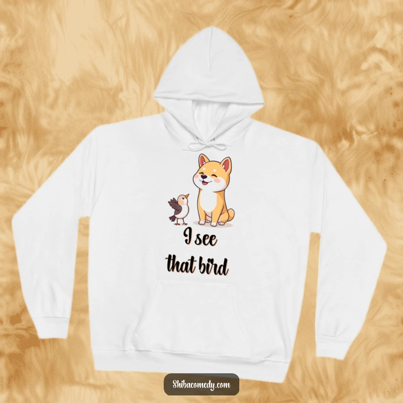Funny Shiba Inu Hoodie: A cozy Shiba Inu with a happy head tilt looks up, captivated by a bird, radiating warmth and humor.