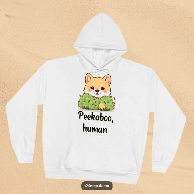 Funny Shiba Inu Hoodie: A mischievous Shiba Inu peeks from a bush, offering a cozy and humorous feeling of playful intrigue.