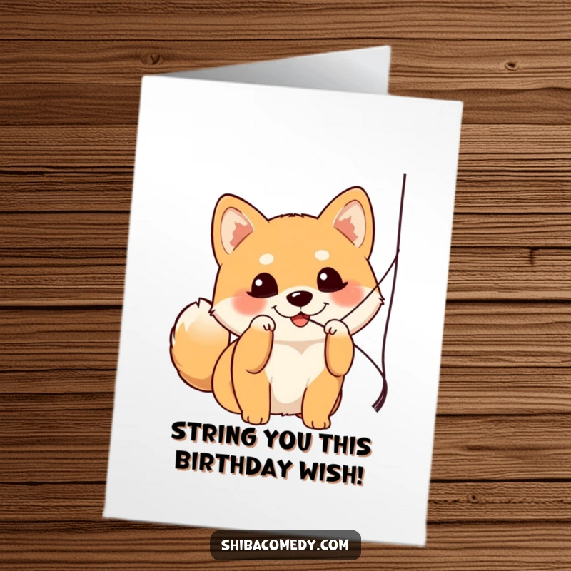 Funny Free Printable Birthday Card: Adorable Shiba Inu with bright eyes playfully batting at a dangling string.